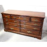 A reproduction long chest of drawers,