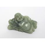 A jadeite reclining Buddha figurine, length 9cm.