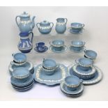 A quantity of Wedgwood embossed Queensware to include a vase, cup and saucer,