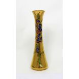 Moorcroft; a trumpet-shaped vase, gold ground with 'Lily' decoration, initialled 'K.W.