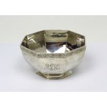 A George V hallmarked silver octagonal dish, the rim with bright-cut decoration, inscribed 'AEK',