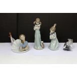 Four boxed Lladró figures; two young girls with kittens,