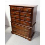 A reproduction mahogany chest of drawers,