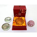A small group of glass paperweights to include a boxed Liuligongfang amber glass example with