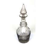 A Victorian cut glass decanter with pointed stopper.