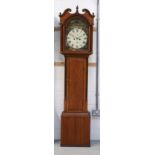A 19th century oak eight-day longcase clock with painted arched enamel dial set with Roman numerals,