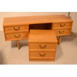 A G-Plan kneehole dressing table with matching bedside cabinet (2).