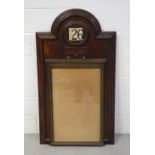 An early 20th century mahogany and bronze glazed community notice board with incorporated scrolling