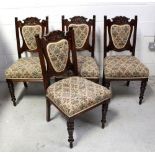 Four early 20th century mahogany shield-back dining chairs,