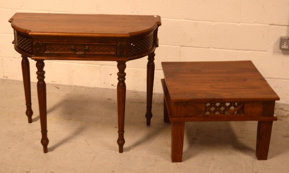 A 20th century demi-lune hall table with cut fretwork frieze on tapering fluted supports,