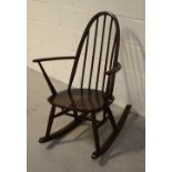 An Ercol rocking chair of small proportions.