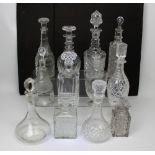 A large quantity of assorted decanters and stoppers (approx 26).