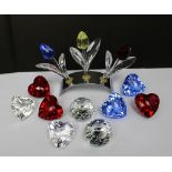 A selection of Swarovski crystal paperweights comprising two SCS crystal ball paperweights and
