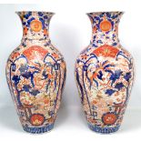 A large pair of Japanese Meiji period Imari vases, height 60cm (both AF).