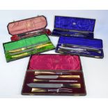 Four cased three piece antler handled Sheffield steel bladed carving sets including Wheatley Bros,