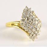 An 18ct yellow gold and diamond dress ring, the melee diamonds set in a domed lozenge,