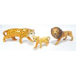 Three Beswick figures comprising a lion no.2089, a lion cub no.2098, and a leopard no.1082 (3).