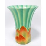 A Royal Worcester Art Deco style faceted tapering vase with impressed mould motifs to lower body,