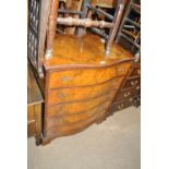 A walnut serpentine front five drawer chest, width 77cm.