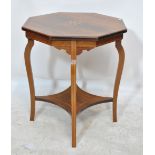 An Edwardian rosewood and satinwood inlaid octagonal two-tier occasional table on cabriole legs.