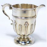 WILLIAM AITKEN; an Edward VII hallmarked silver jug with cast decoration to lower body,