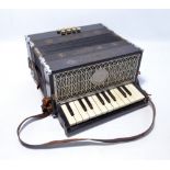 An Antoria 'Ludwig' piano accordion with leather straps.