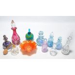 A small collection of nine various glass scent bottles to include Caithness and Mdina examples and