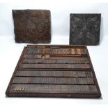 Two wooden copper and iron foliate scroll printing blocks,