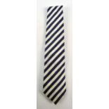 PAUL SMITH; a silk tie decorated with grey and navy blue diagonal stripes.