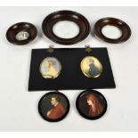 A pair of circular painted portrait miniatures,