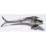 A Spanish silver articulated model of fish with green round cut stone set eyes, length 8cm,