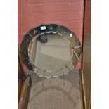 An Art Deco shaped circular wall mirror, diameter 55.5cm.