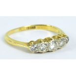 An 18ct yellow gold graduated five stone diamond ring, size K, approx 2.2g.