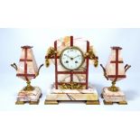 A French Art Deco marble and gilt metal mounted three piece clock garniture,