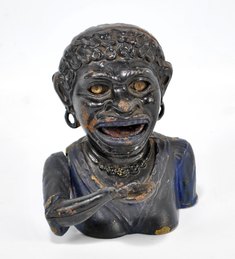 A cast iron Dinah figural money box, height 17cm.