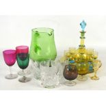 A small collection of coloured glass to include a set of amber and blue liqueur glasses with