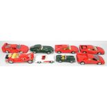 A small group of diecast model sports cars comprising Burago Ferrari Testarossa (1984),