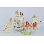 Four 19th century Staffordshire figures to include 'Peace' (af) and a little girl wearing a red