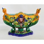 A large reproduction majolica figural urn, width 47cm.