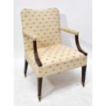 A Georgian mahogany Gainsborough type cream upholstered open armchair with fluted supports to the