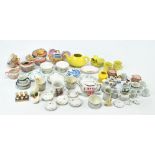 A quantity of children's ceramic toy tea ware in various sets and individual items including cups,