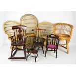 A group of doll sized wicker/straw work furniture comprising three chairs and four smaller wooden