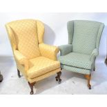 A Victorian mahogany framed upholstered wing back armchair, and another chair (2).