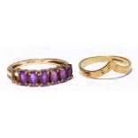 A 9ct yellow gold dress ring set with oval cut purple stones (one missing), size O,