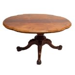 A Victorian mahogany loo table with shaped oval top and raised on four outswept supports.