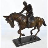 A bronze figure of a galloping horse and jockey, unsigned and unmarked,