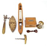 A small group of collectors' items to include a weaving shuttle converted to a thermometer,