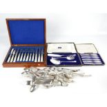 A walnut cased set of mother of pearl handled fish knives and forks,