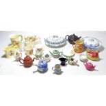 A collection of mixed ceramics to include a number of small teapots and jugs in various styles and