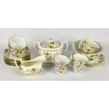 A 19th century hand painted floral decorated part tea set comprising a sucrier, a jug, a slop bowl,